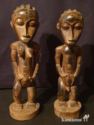 120-21-Afri  Pareja de figuras Baule, 60 y 57 x 15 cms