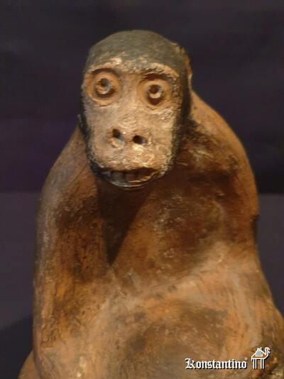 15-Afri  Figura mono africano en terracota  23x14 cms
