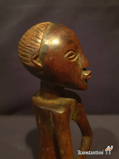 1265-Afri  Figura antigua africana en madera  21x5 cms